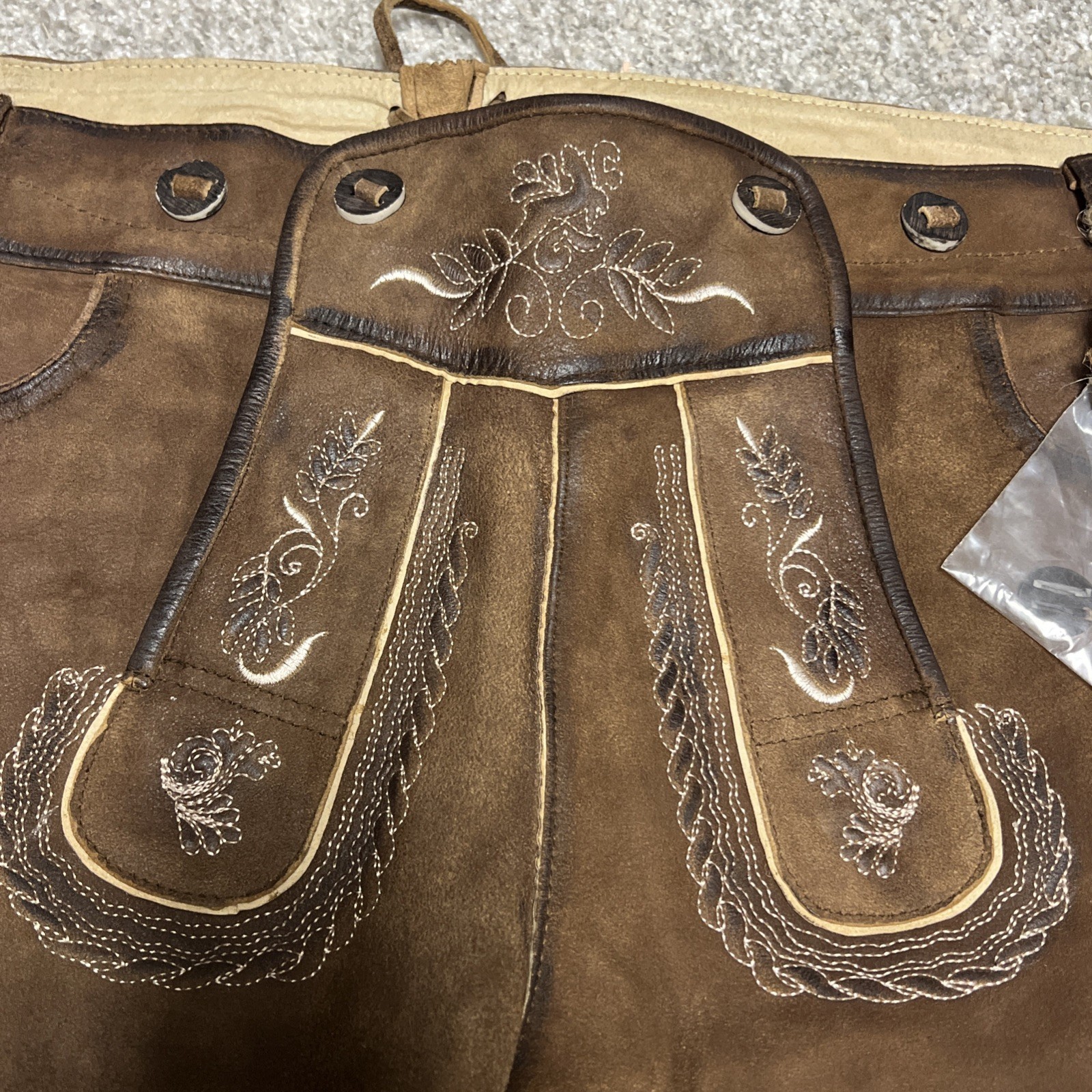 Bavarian Lederhosen leather shorts with intricate embroidery. Men’s US 34