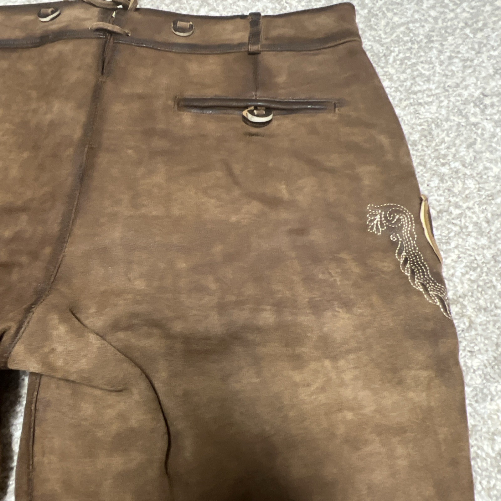 Bavarian Lederhosen leather shorts with intricate embroidery. Men’s US 34