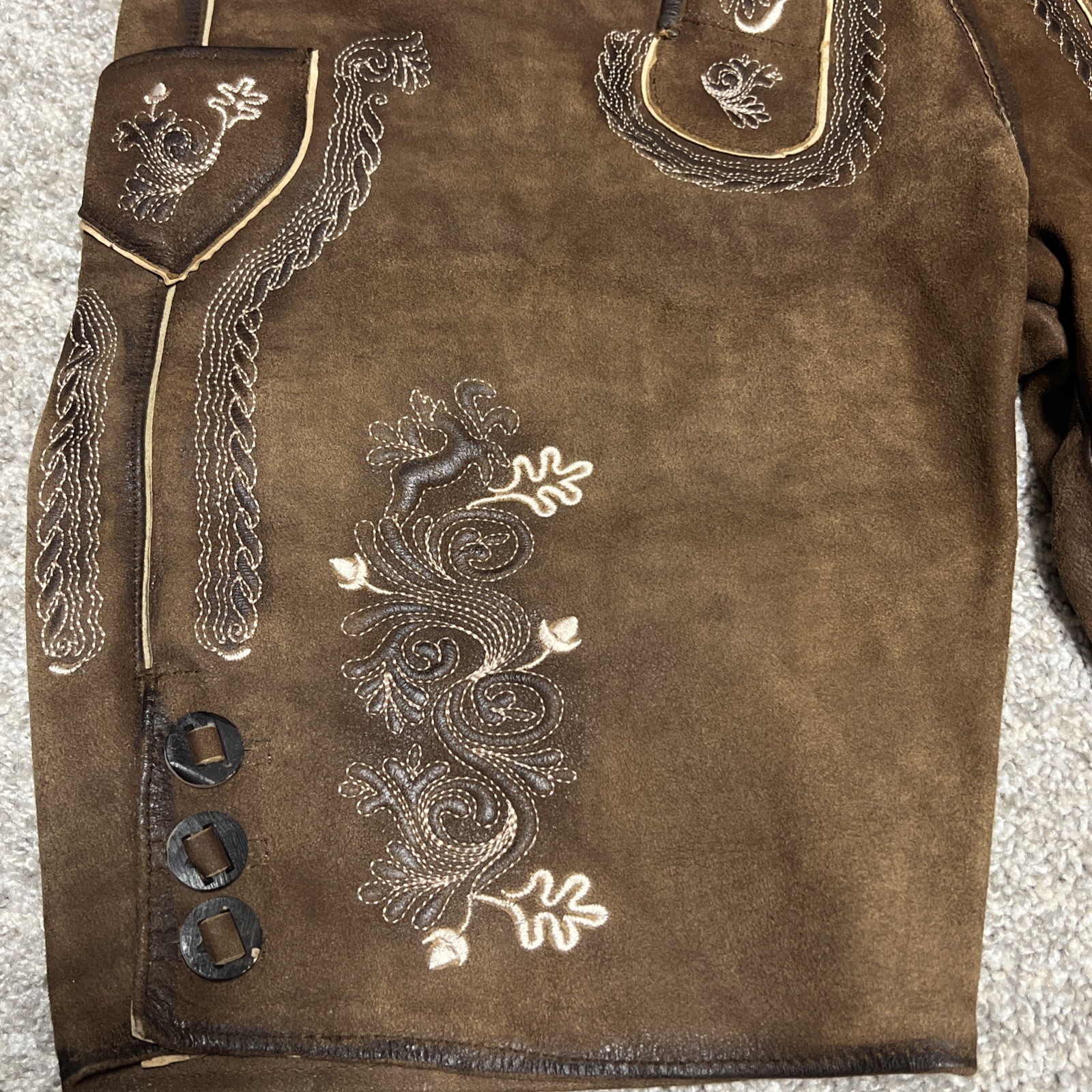 Bavarian Lederhosen leather shorts with intricate embroidery. Men’s US 34