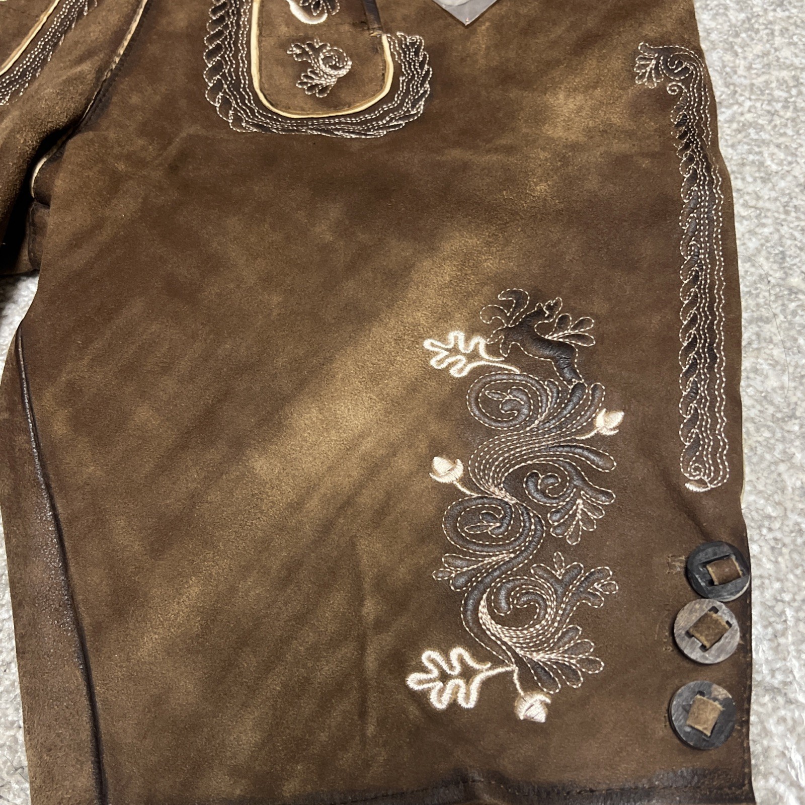 Bavarian Lederhosen leather shorts with intricate embroidery. Men’s US 34