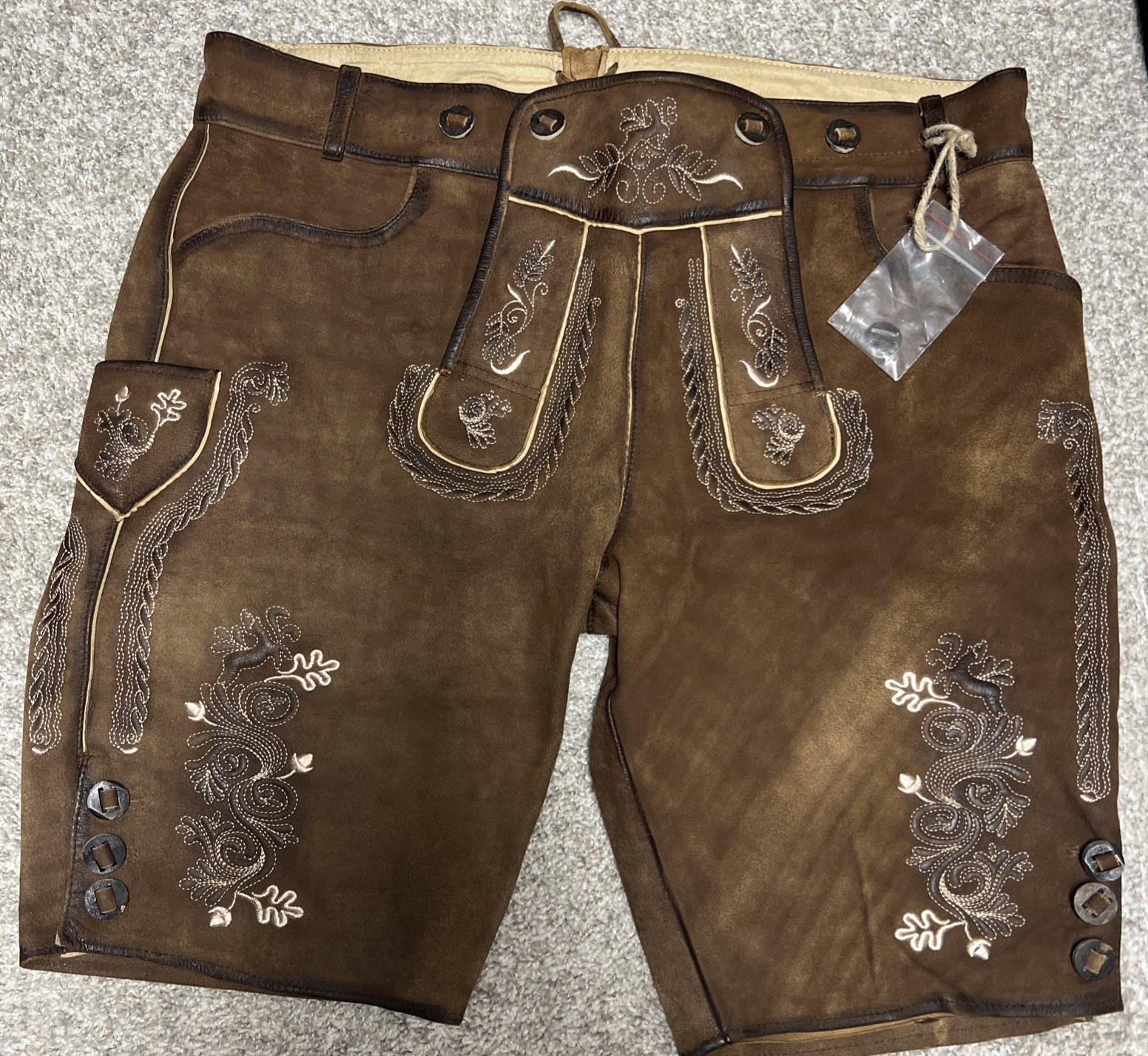 Bavarian Lederhosen leather shorts with intricate embroidery. Men’s US 34