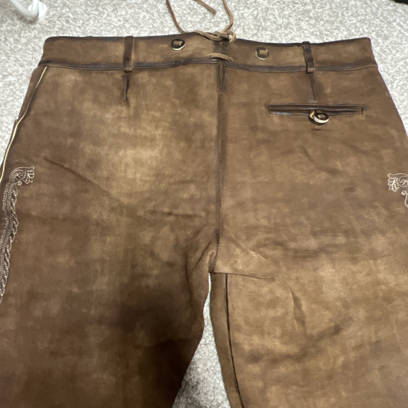Bavarian Lederhosen leather shorts with intricate embroidery. Men’s US 34