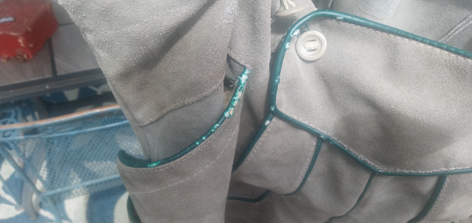 Traditional brown suede lederhosen with green piping accents side-button closure